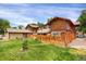 Large backyard with wood fence, lawn and building at 1255 S Dillon Way, Aurora, CO 80012