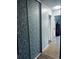 Hallway featuring closet with decorative sliding doors and a view of other rooms in the home at 1255 S Dillon Way, Aurora, CO 80012
