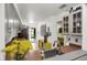 Bright kitchen with stainless steel appliances, granite countertops, wood cabinets, and eat-in breakfast bar at 1255 S Dillon Way, Aurora, CO 80012