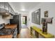 Spacious kitchen with stainless steel appliances and sliding glass doors to the backyard at 1255 S Dillon Way, Aurora, CO 80012