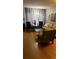 Modern living room with hardwood floors, stylish furniture, and elegant lighting at 1255 S Dillon Way, Aurora, CO 80012