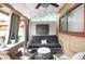 Cozy covered patio features comfortable seating and unique decor at 1255 S Dillon Way, Aurora, CO 80012