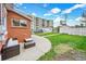 Spacious backyard with a patio, storage shed, and well-maintained lawn at 2204 S Acoma St, Denver, CO 80223