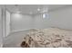 Spacious basement bedroom with neutral carpeting and bright recessed lighting at 2204 S Acoma St, Denver, CO 80223