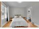 Cozy bedroom with hardwood floors, neutral walls, and ample natural light at 2204 S Acoma St, Denver, CO 80223