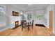 Bright dining room features a fireplace, wood floors, and a cozy atmosphere for memorable meals at 2204 S Acoma St, Denver, CO 80223
