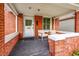 Inviting covered front porch with seating, perfect for relaxing outdoors at 2204 S Acoma St, Denver, CO 80223