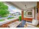 Welcoming front porch with a seating area and views of the quiet street at 2204 S Acoma St, Denver, CO 80223