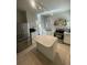Modern kitchen features an island, stainless appliances, and ample storage for culinary enthusiasts at 2204 S Acoma St, Denver, CO 80223