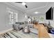 Spacious open layout featuring a living room that seamlessly connects to the dining area for entertaining at 2204 S Acoma St, Denver, CO 80223