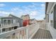 Balcony view of neighborhood homes, showing architectural details and community feel at 46526 Avery Ln, Bennett, CO 80102