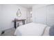 Cozy bedroom featuring stylish decor, a desk, and ample closet space at 46526 Avery Ln, Bennett, CO 80102