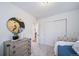 Bright bedroom featuring neutral colors, stylish decor, and a closet for plenty of storage space at 46526 Avery Ln, Bennett, CO 80102