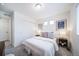 Neat bedroom with a queen size bed and matching bedside tables with decorations at 46526 Avery Ln, Bennett, CO 80102