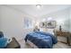 Inviting bedroom boasts a comfortable queen bed, window for natural light, and coordinating decor at 46526 Avery Ln, Bennett, CO 80102