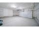 Spacious unfinished two car garage with plenty of space for storage and vehicles at 46526 Avery Ln, Bennett, CO 80102