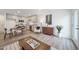 Open concept living area with a modern kitchen, dining table, living area, and stylish decor at 46526 Avery Ln, Bennett, CO 80102