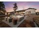 Extensive backyard with a patio, fire pit, hot tub, and outdoor seating, perfect for entertaining at 6001 Powell Rds, Parker, CO 80134