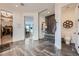 Bright primary bathroom with a glass shower, gray tile, and access to the walk in closet and toilet room at 6001 Powell Rd, Parker, CO 80134