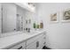 Contemporary bathroom features a white vanity with quartz countertop and stylish fixtures at 6001 Powell Rds, Parker, CO 80134