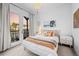 Cozy bedroom featuring a comfortable bed, a private balcony, and charming decor at 6001 Powell Rds, Parker, CO 80134