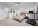 Bedroom with neutral tones, ceiling fan, guitars on wall, and exercise equipment at 6001 Powell Rds, Parker, CO 80134
