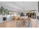 Airy dining room with modern light fixture and views to the patio at 6001 Powell Rd, Parker, CO 80134