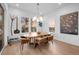 Contemporary dining room featuring a wooden table, stylish seating, and scenic window views at 6001 Powell Rds, Parker, CO 80134