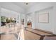 Elegant entryway featuring light hardwood floors, white walls, an open floor plan, and views to dining and living areas at 6001 Powell Rds, Parker, CO 80134