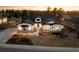 Charming single-Gathering home with a well-manicured lawn, white siding, stone accents, and a welcoming front porch at 6001 Powell Rds, Parker, CO 80134