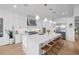 Bright kitchen with a large island with seating and stainless steel appliances at 6001 Powell Rd, Parker, CO 80134