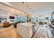 Open concept kitchen with a large island, stainless steel appliances, and views to the living room at 6001 Powell Rd, Parker, CO 80134