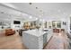 Bright open-concept living area with island kitchen, fireplace living room, and comfortable dining at 6001 Powell Rds, Parker, CO 80134