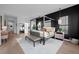 Spacious main bedroom with a modern four-poster bed, stylish furnishings, and bright natural light at 6001 Powell Rds, Parker, CO 80134