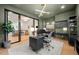 Contemporary office space with sleek desk and view of a bright sitting area at 6001 Powell Rds, Parker, CO 80134