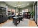 Stylish home office with custom cabinetry and large windows at 6001 Powell Rds, Parker, CO 80134