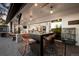 Covered patio with bar seating, outdoor dining, and seamless access to indoor living spaces at 6001 Powell Rds, Parker, CO 80134