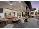 Spacious outdoor patio with comfortable seating, outdoor bar, and seamless indoor-outdoor living at 6001 Powell Rds, Parker, CO 80134
