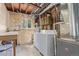 Unfinished basement featuring laundry hookups, utilities, and storage space at 1313 Garden Cir, Longmont, CO 80501