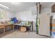 Unfinished basement featuring a workbench, storage, and utility connections at 1313 Garden Cir, Longmont, CO 80501