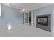 A finished basement offers carpeted floors, a fireplace, and built-in shelving at 1313 Garden Cir, Longmont, CO 80501