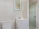 Bathroom featuring a white vanity, toilet, and a glass-enclosed shower at 1313 Garden Cir, Longmont, CO 80501