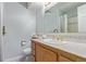 Bathroom with wood cabinets, white countertops, and tiled accents at 1313 Garden Cir, Longmont, CO 80501