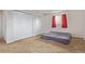 Bedroom with red curtains, and large closets at 1313 Garden Cir, Longmont, CO 80501