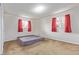 Spacious bedroom with large windows, neutral carpet, and ample natural light at 1313 Garden Cir, Longmont, CO 80501