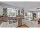 Kitchen with white cabinets, stainless steel appliances, granite countertops, and view to dining room at 1313 Garden Cir, Longmont, CO 80501