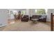 Spacious living room leading into the dining area with natural light at 1313 Garden Cir, Longmont, CO 80501