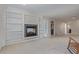Cozy living room with a fireplace and built-in shelving, perfect for relaxing at 1313 Garden Cir, Longmont, CO 80501