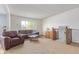 Bright living room featuring a large window and comfortable seating area at 1313 Garden Cir, Longmont, CO 80501