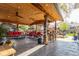 Covered patio with a stamped concrete floor, an outdoor kitchen, and lounge area at 1313 Garden Cir, Longmont, CO 80501